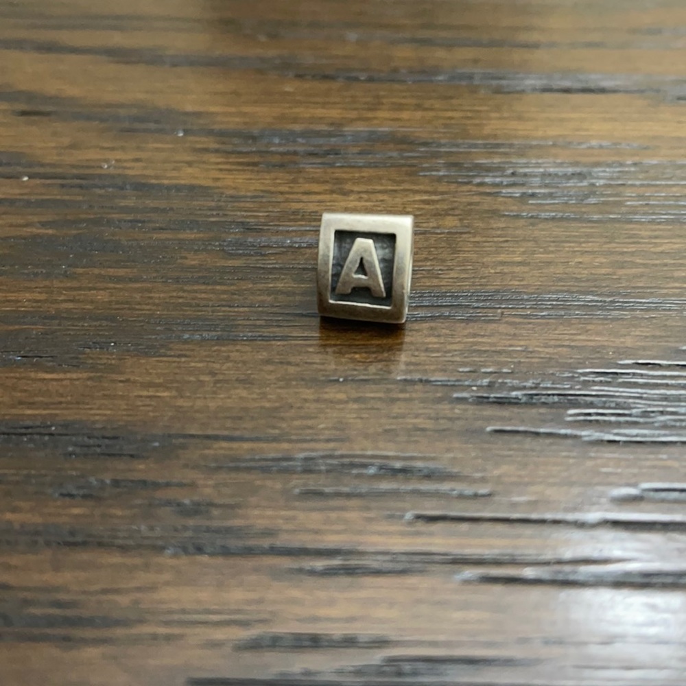 Beautiful retired letter charm
